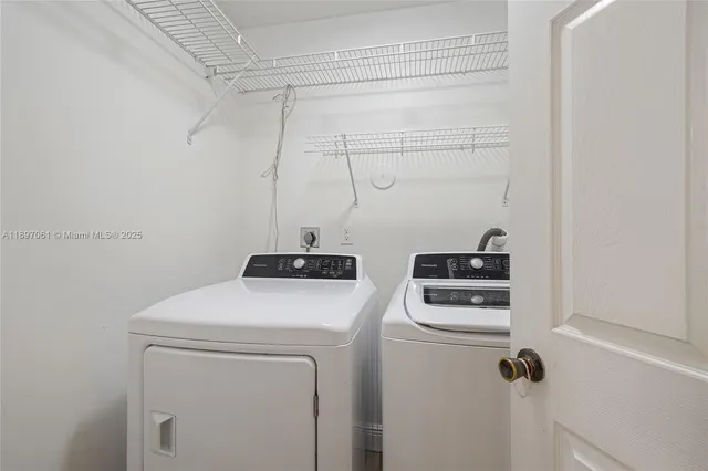 a utility room with dryer and washer