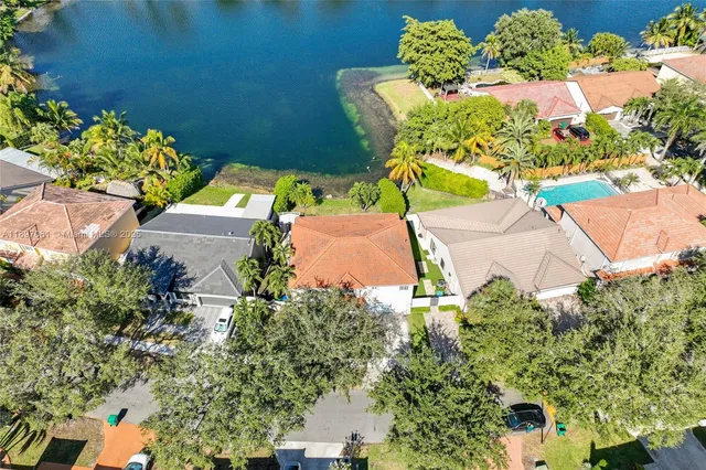 an aerial view of a house with a yard and garden