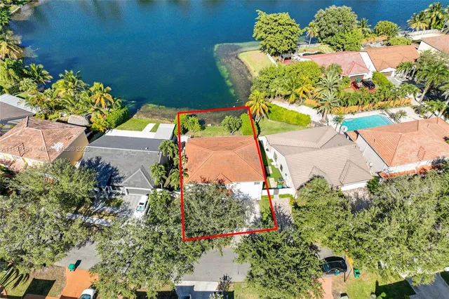 an aerial view of a house with a garden