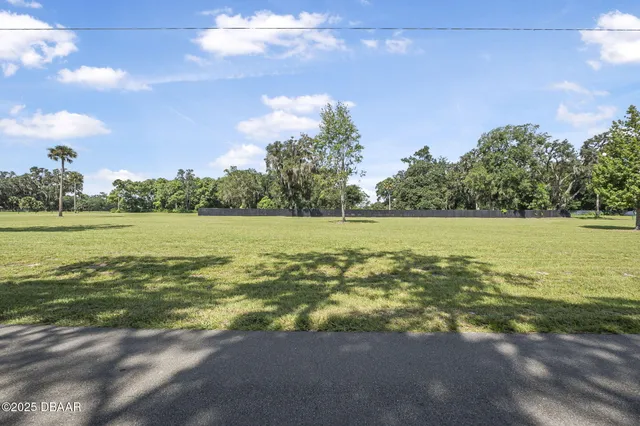 a view of a ocean with a building in the background
