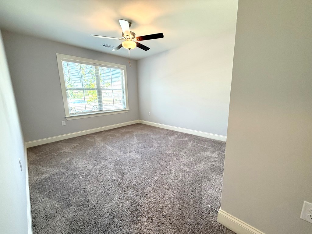 79 Altapass Way Fortson, GA 31808 - Photo 17 of 21 a view of an empty room with a window