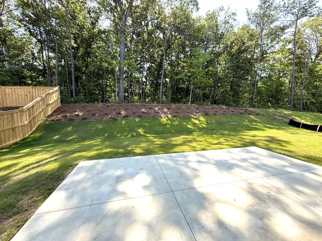 a view of a swimming pool with a yard