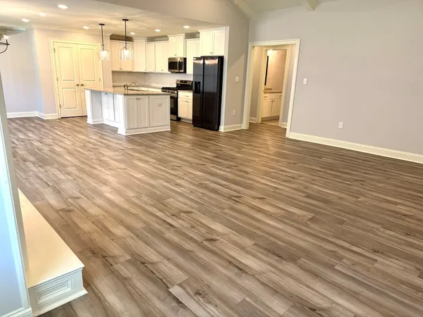 a view of kitchen view with wooden floor