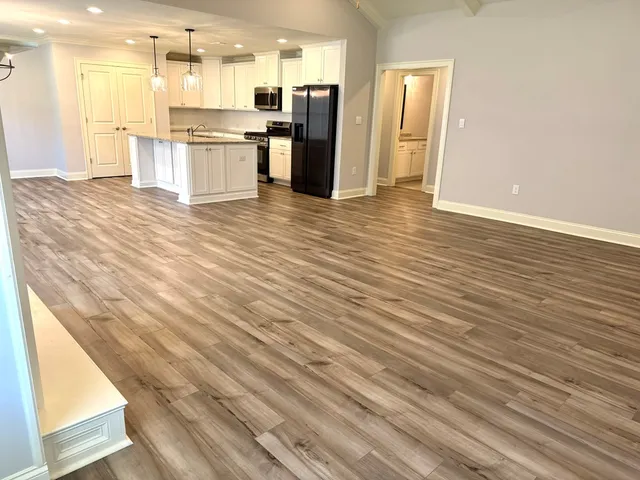 a view of kitchen view with wooden floor