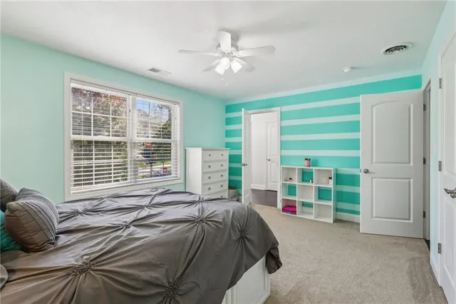 a bedroom with furniture and a window