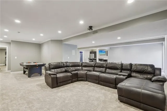 a kitchen that has a sink a table and chairs in it