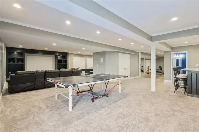 a bathroom with a shower sink and mirror