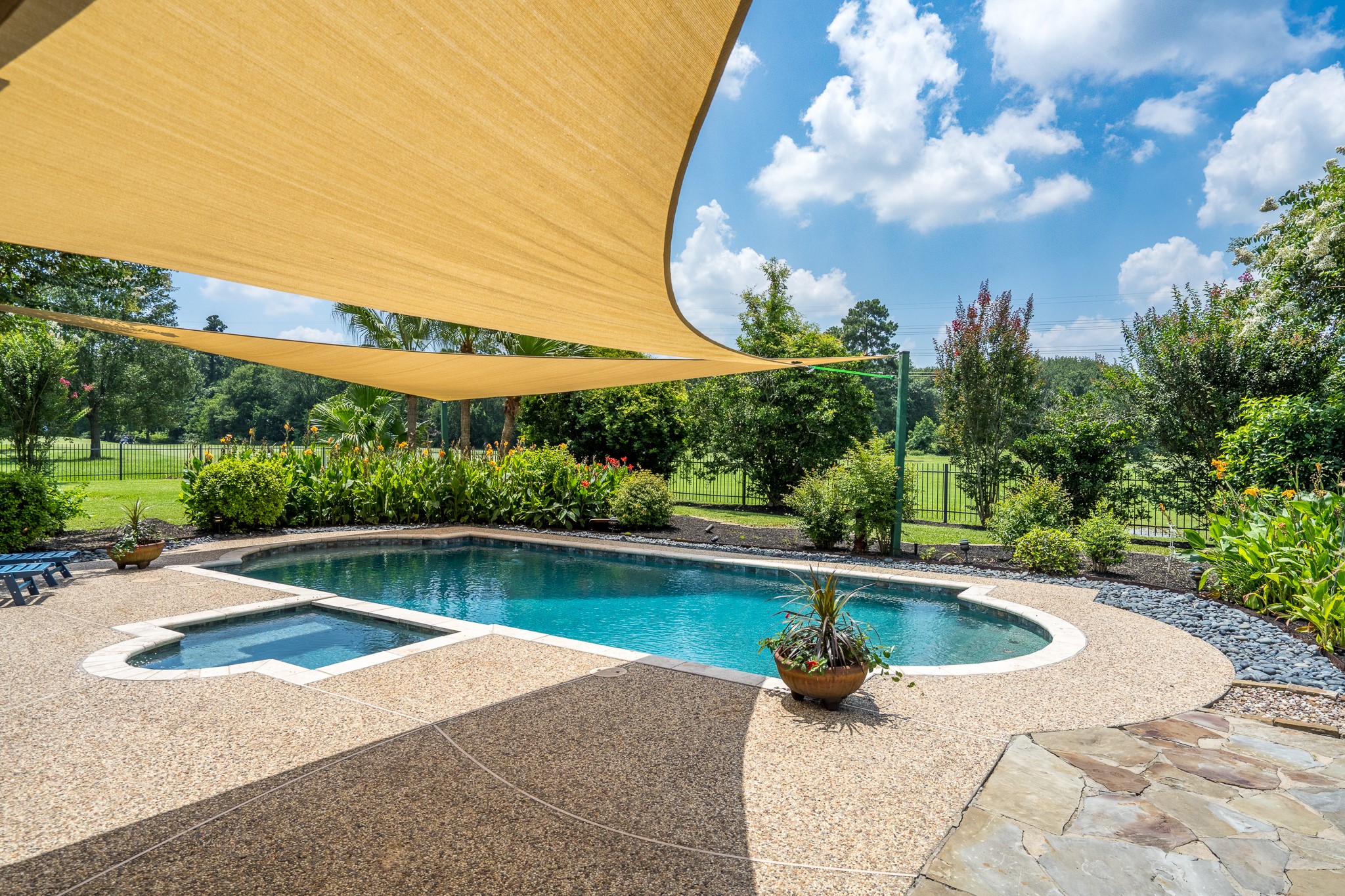 5914 Oakmoss Trail Spring, TX 77379 - Photo 33 of 50 Soaring shades provide both an elegant touch and shade on those hot summer Texas days!