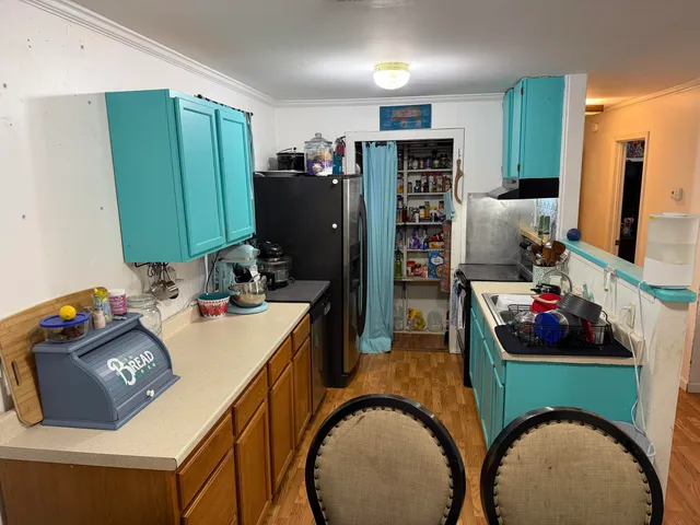 a living room with furniture window and a flat screen tv
