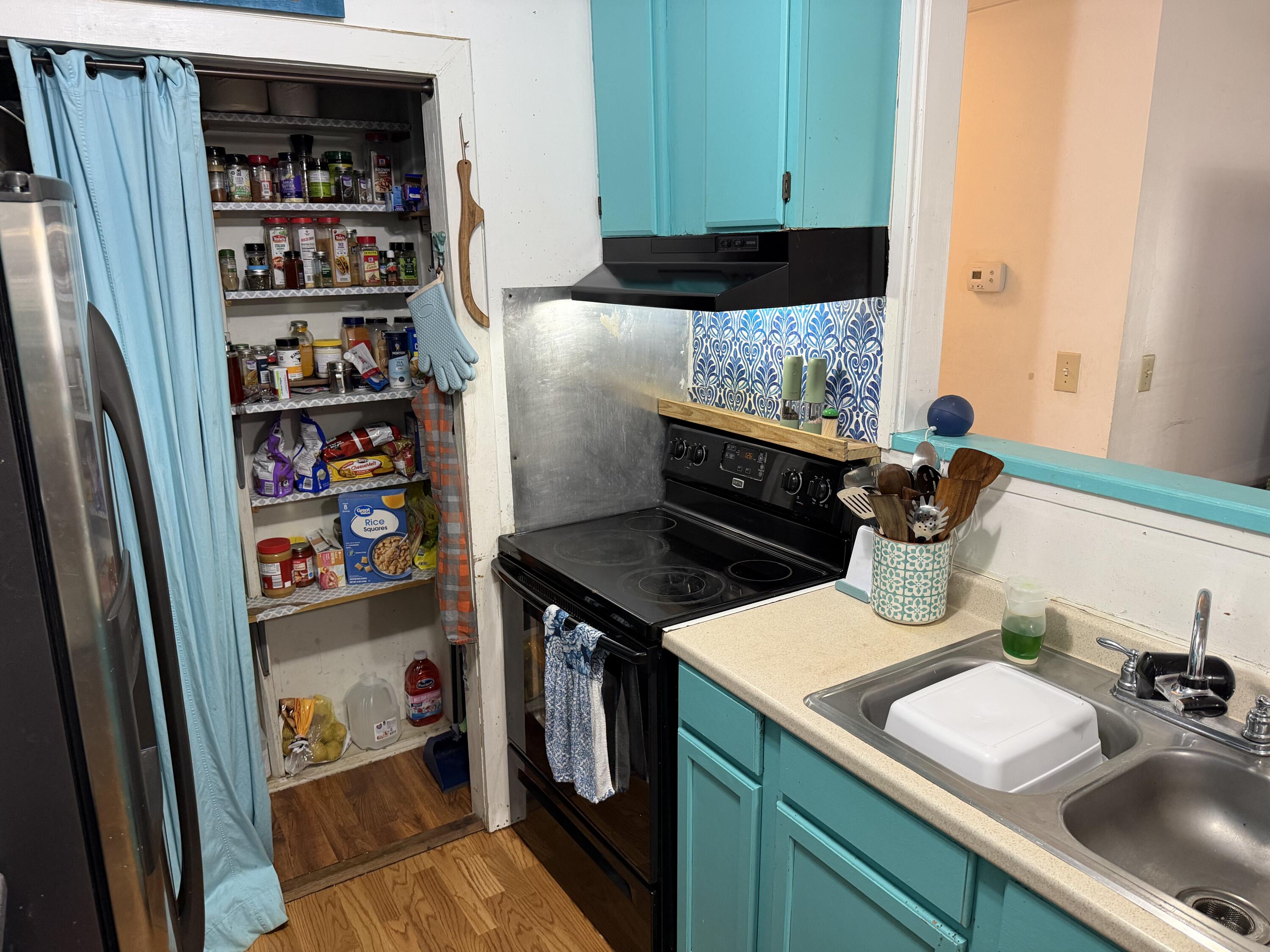 5875 Oak Hill Road Crestview, FL 32536 - Photo 16 of 43 a kitchen with stainless steel appliances a stove and a refrigerator