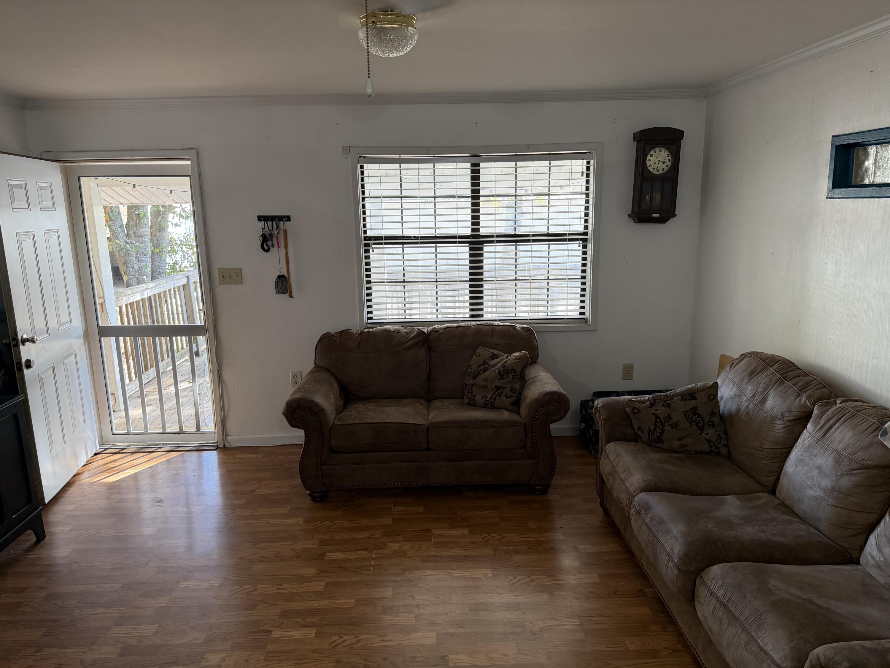5875 Oak Hill Road Crestview, FL 32536 - Photo 19 of 43 a living room with furniture and a window