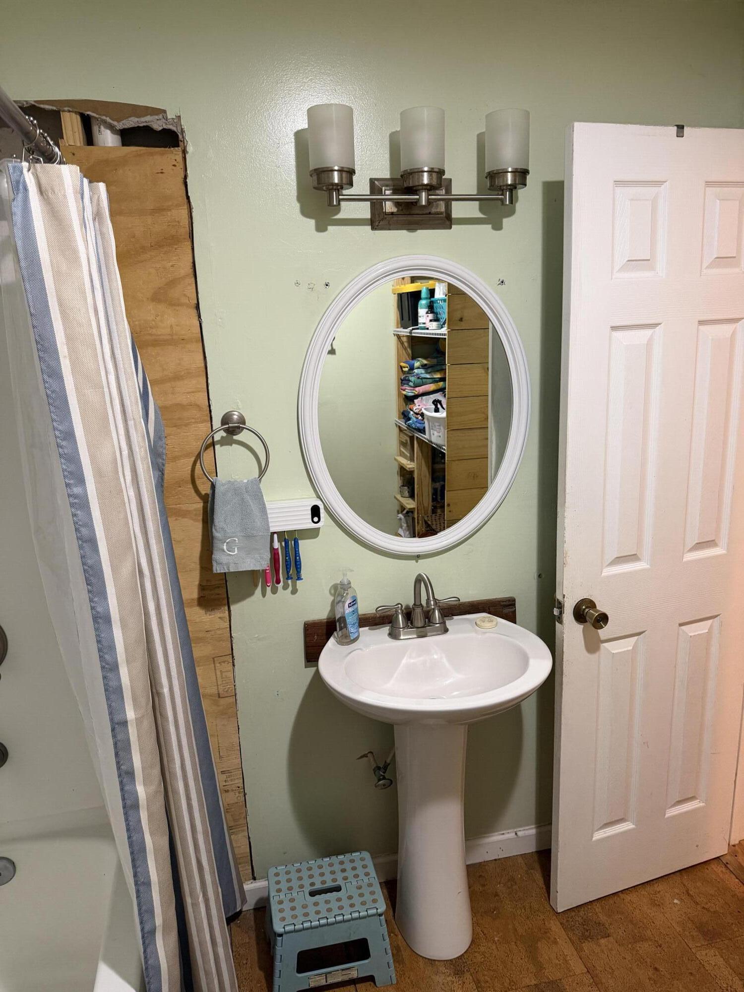 5875 Oak Hill Road Crestview, FL 32536 - Photo 20 of 43 a bathroom with a sink a mirror and toilet