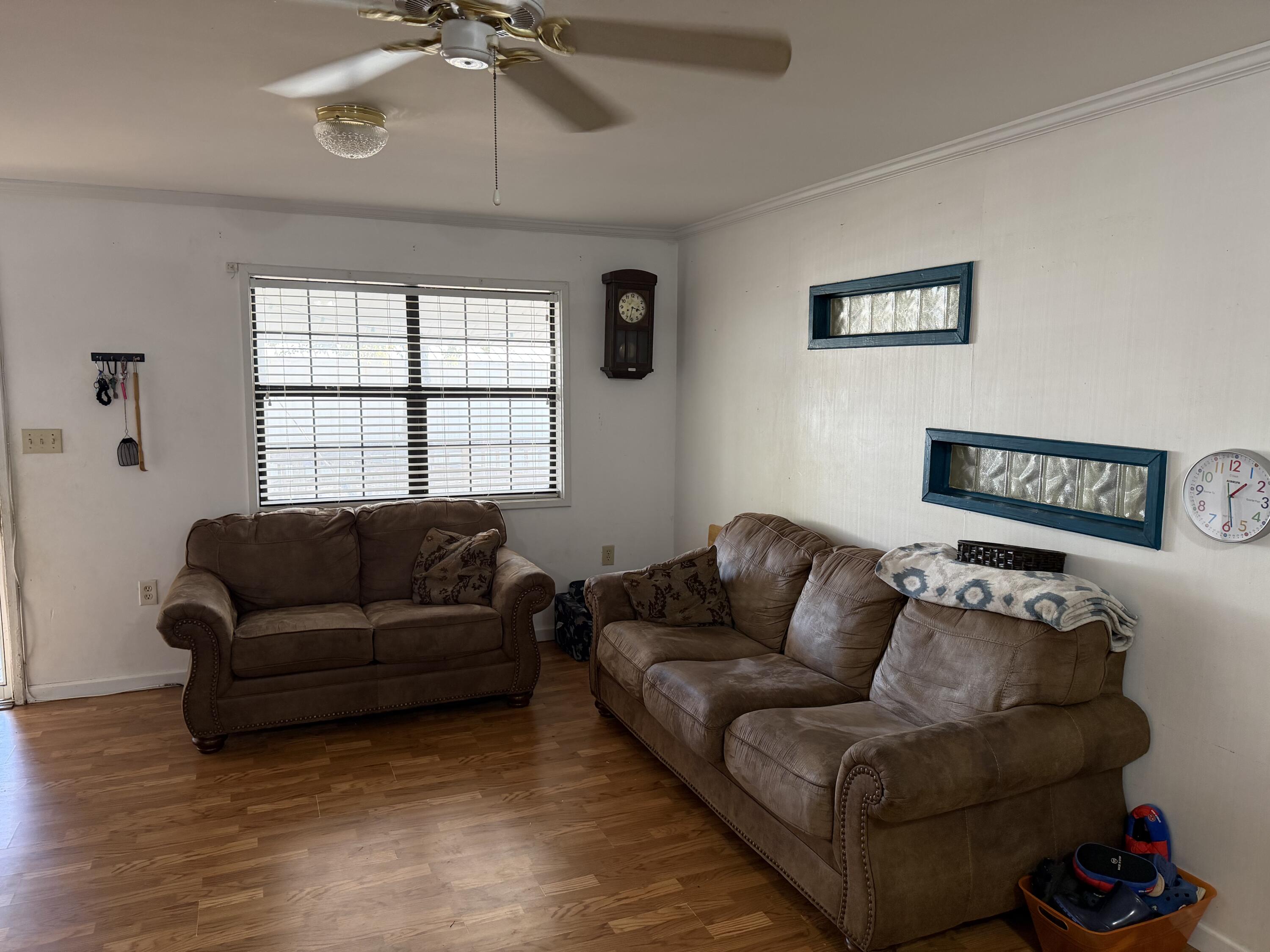 5875 Oak Hill Road Crestview, FL 32536 - Photo 24 of 43 a living room with furniture and a window