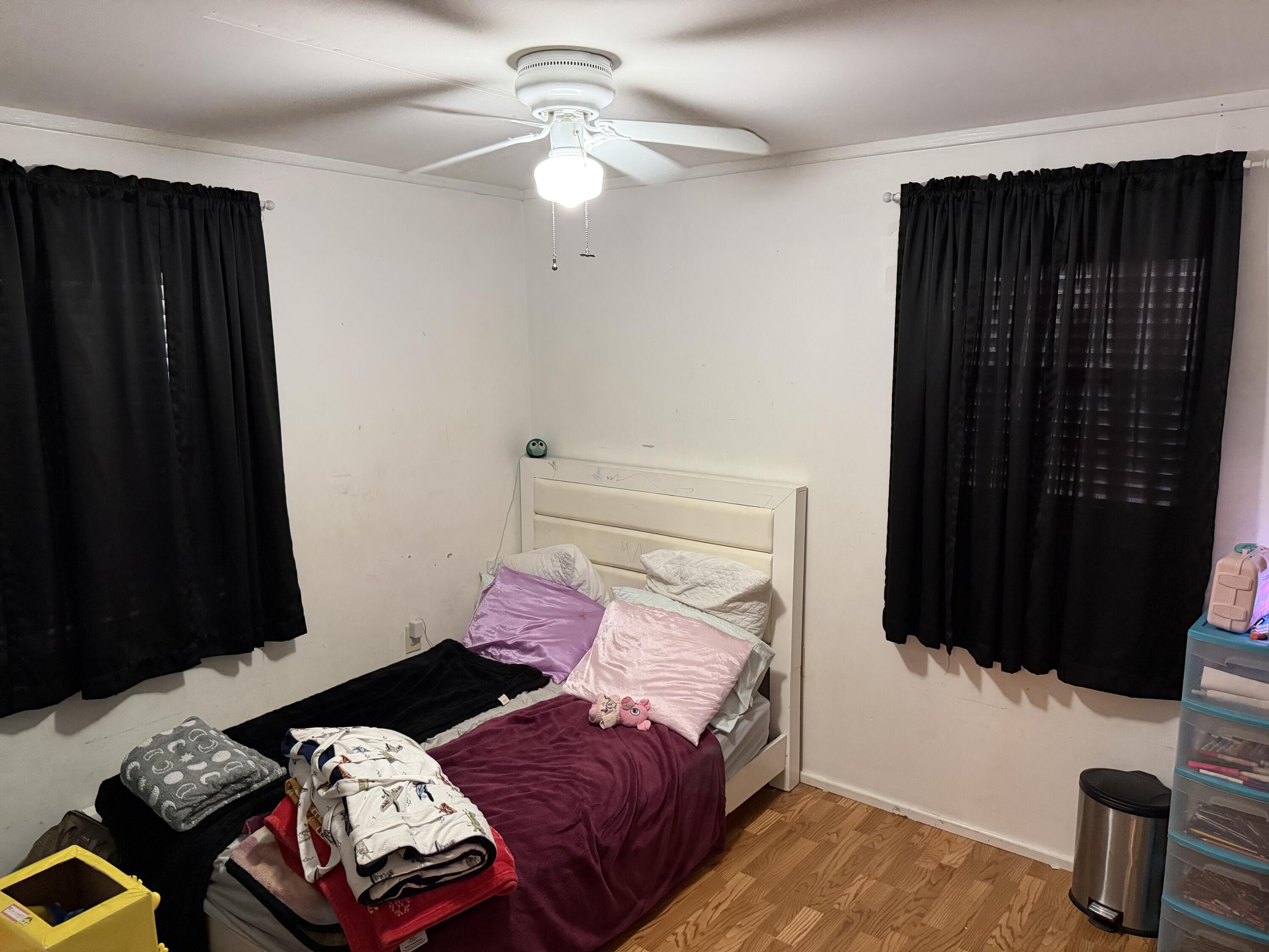 5875 Oak Hill Road Crestview, FL 32536 - Photo 26 of 43 a bedroom with a bed and a window