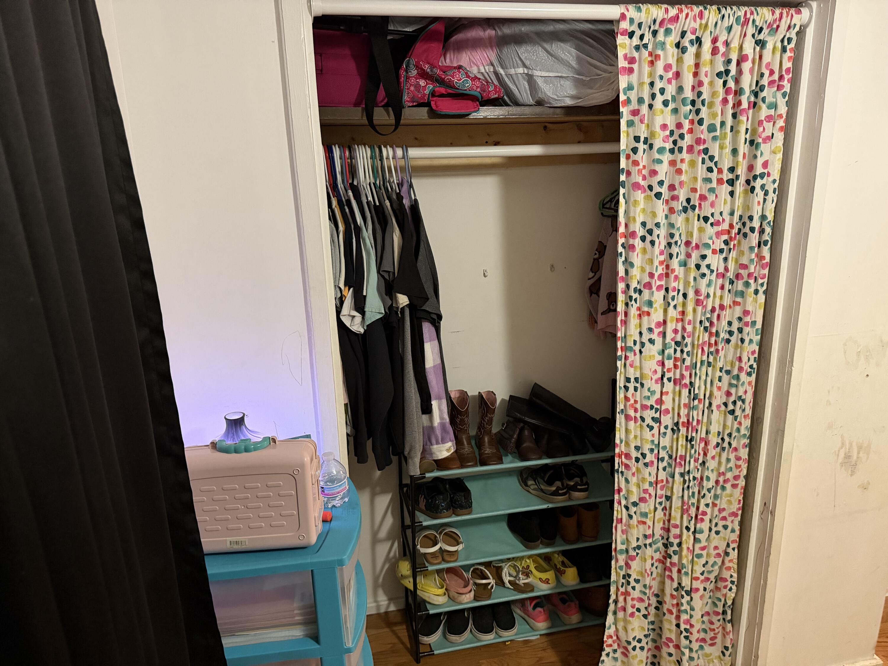 5875 Oak Hill Road Crestview, FL 32536 - Photo 28 of 43 a view of walk in closet with clothes and shoes