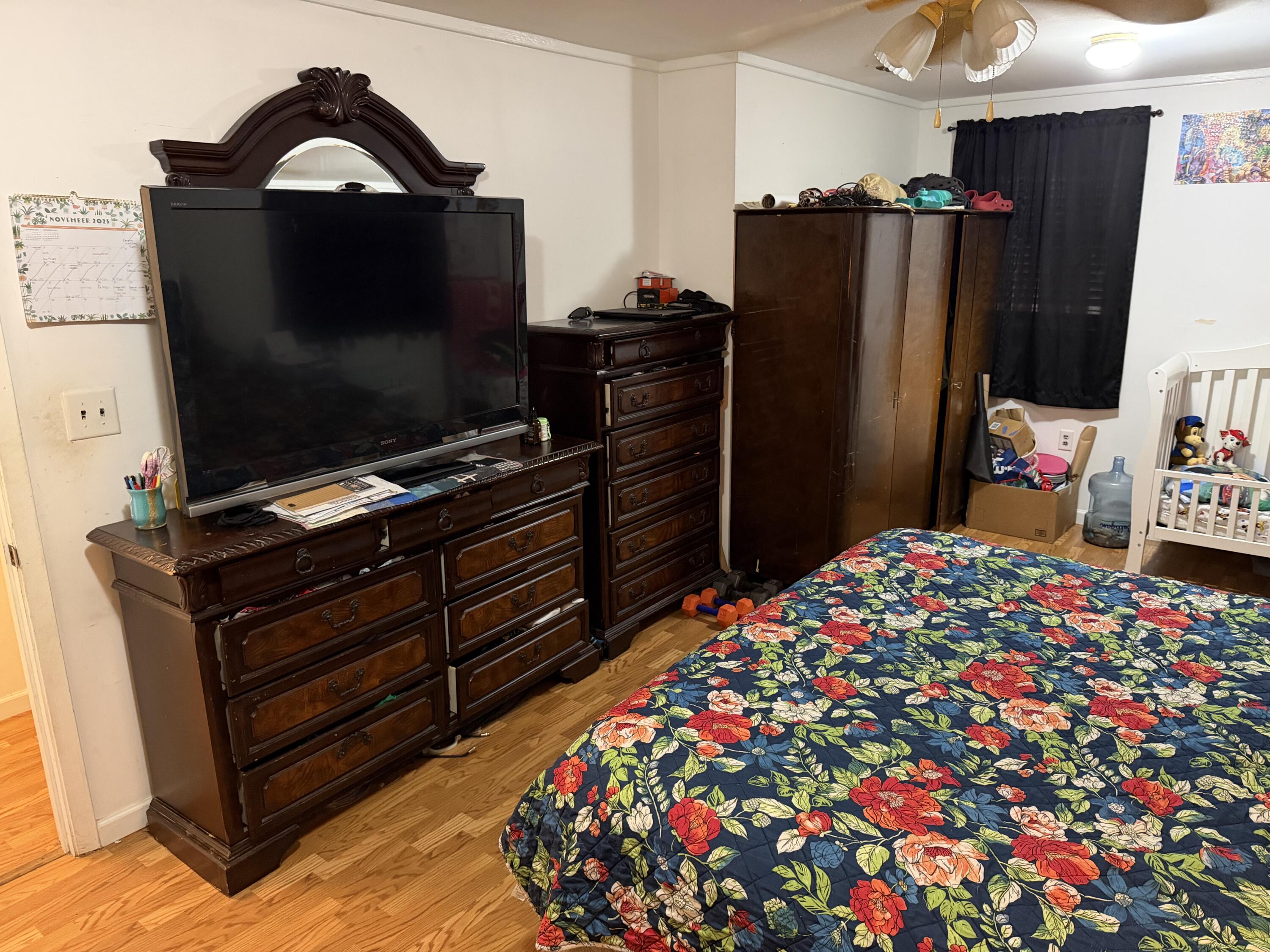 5875 Oak Hill Road Crestview, FL 32536 - Photo 33 of 43 a bedroom with a bed and a flat screen tv