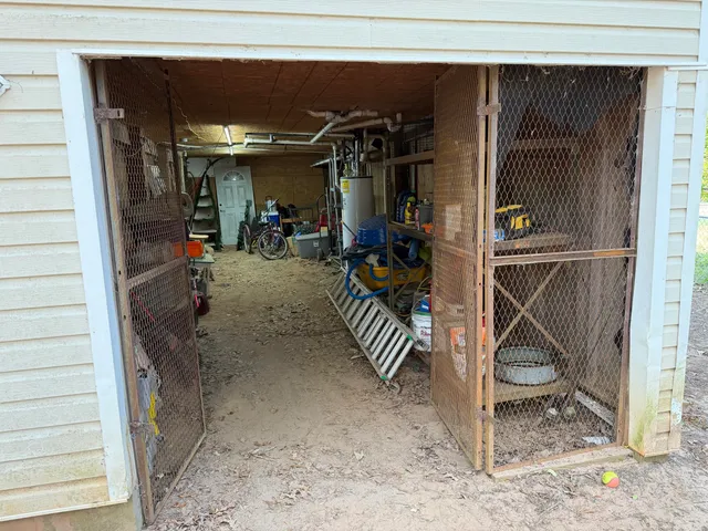 a bathroom with a toilet and a shower curtain