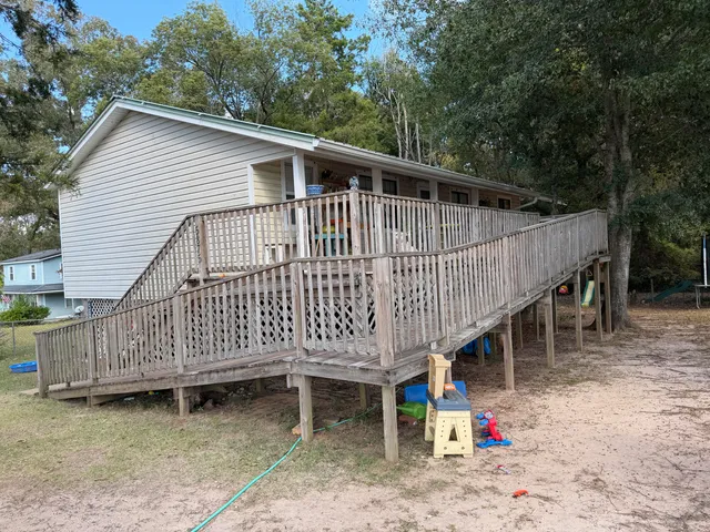 a view of a deck with a yard