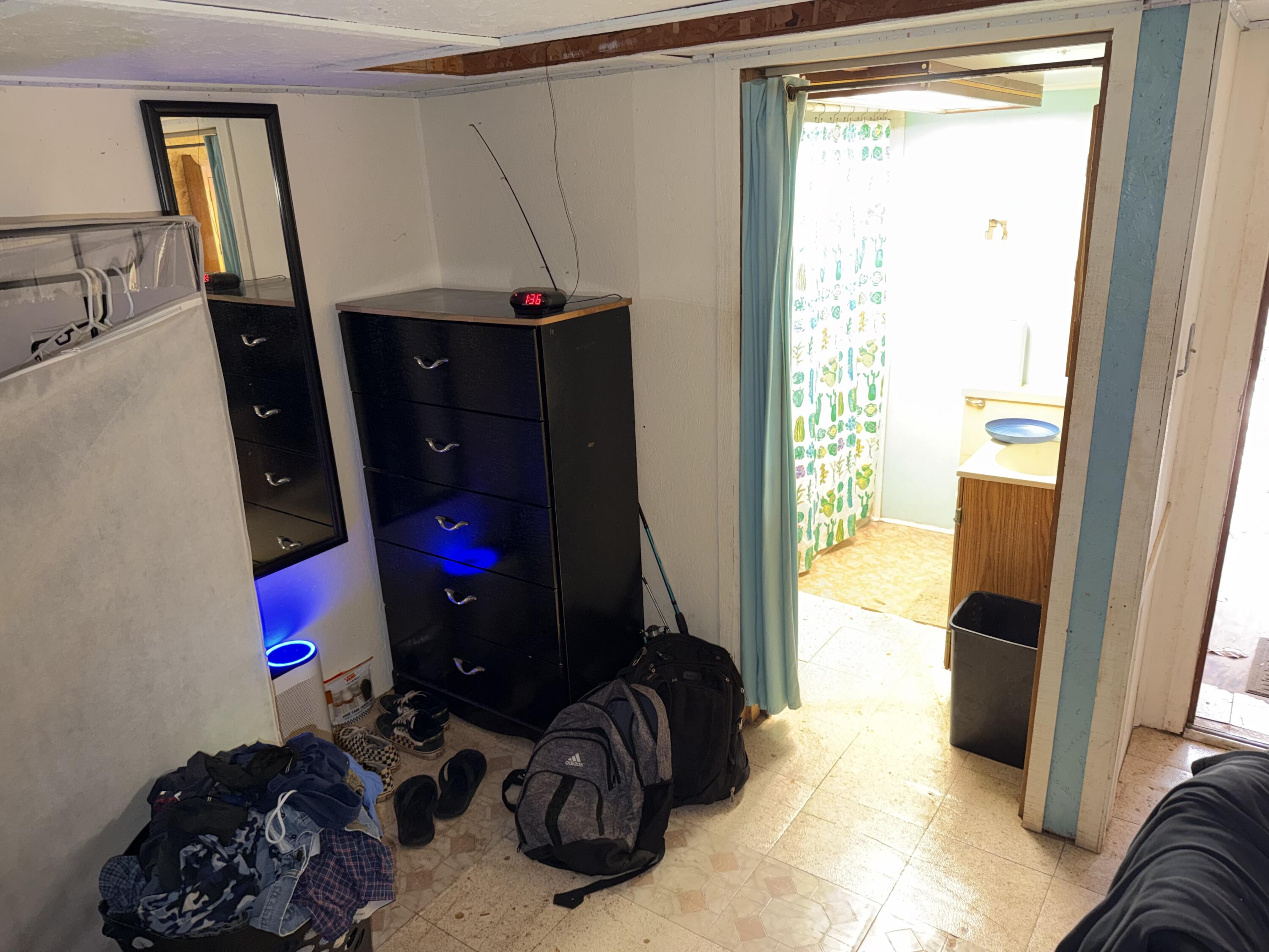 5875 Oak Hill Road Crestview, FL 32536 - Photo 43 of 43 a bedroom with a bed closet and mirror