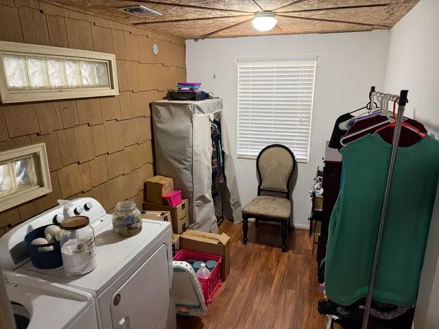 a room with furniture and a potted plant