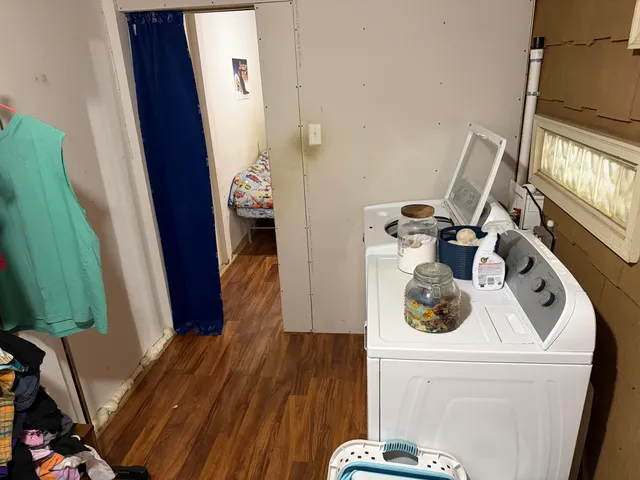 a view of living room with furniture and a fireplace