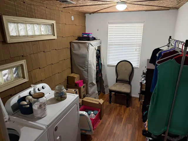 a room with furniture and a wooden floor