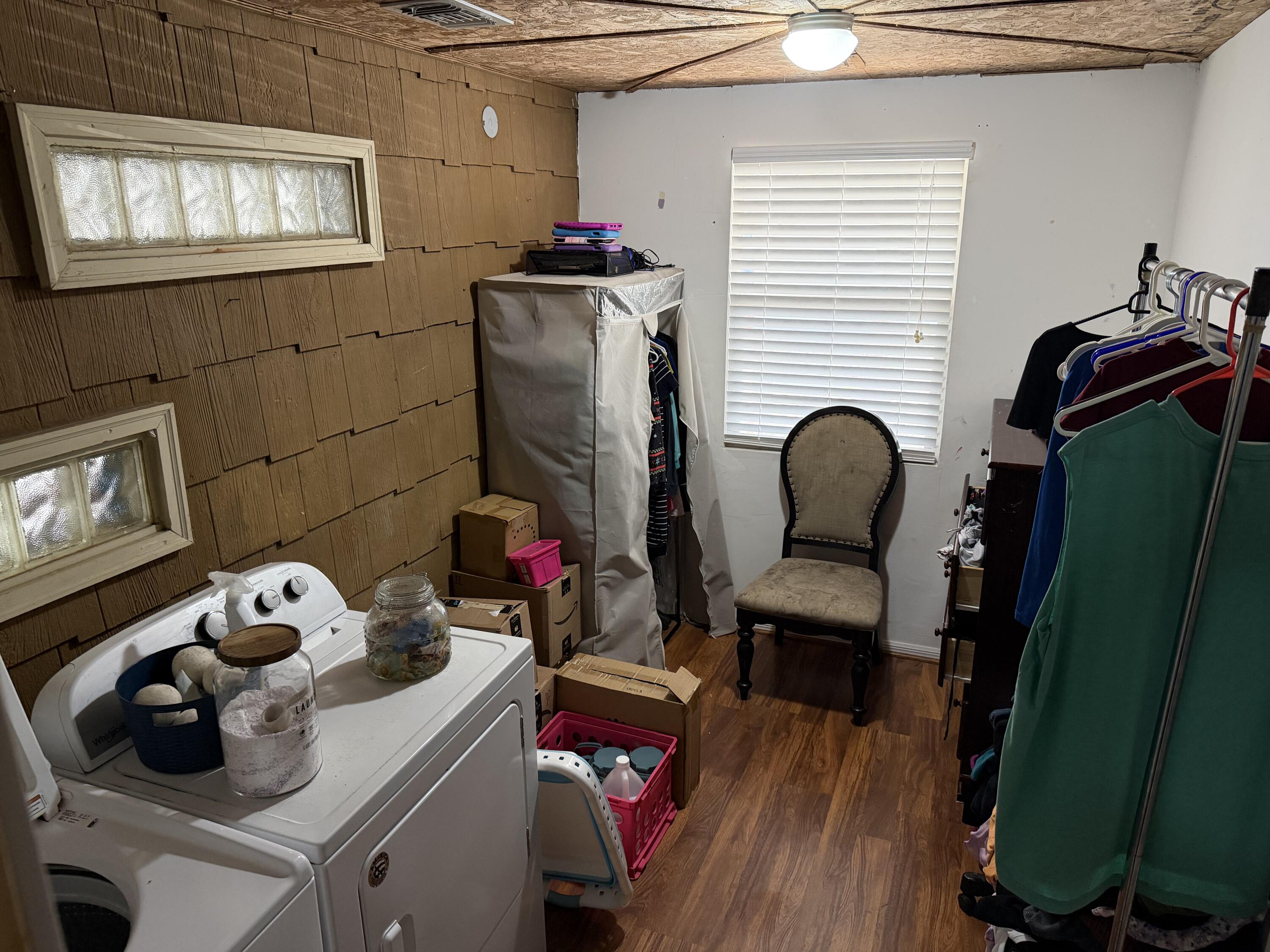 5875 Oak Hill Road Crestview, FL 32536 - Photo 9 of 43 a room with furniture and a wooden floor