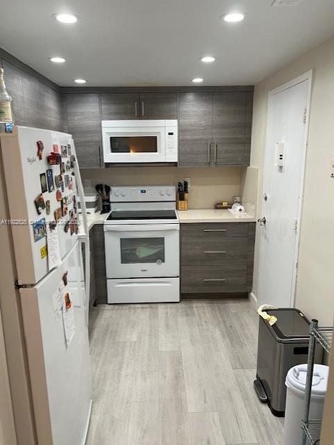 1865 79th Street Causeway, Unit 10C North Bay Village, FL 33141 - Photo 11 of 26 a view of kitchen with stainless steel appliances cabinets and wooden floor