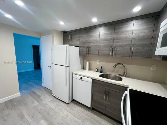 a view of glass windows and a table in a room