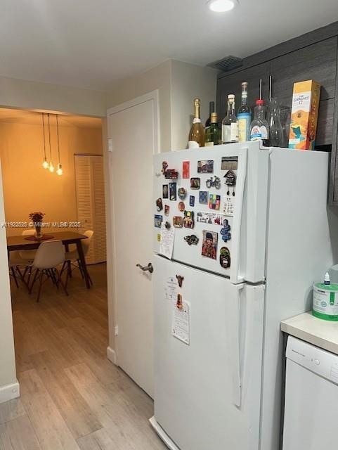 1865 79th Street Causeway, Unit 10C North Bay Village, FL 33141 - Photo 13 of 26 a white refrigerator freezer sitting inside of a kitchen