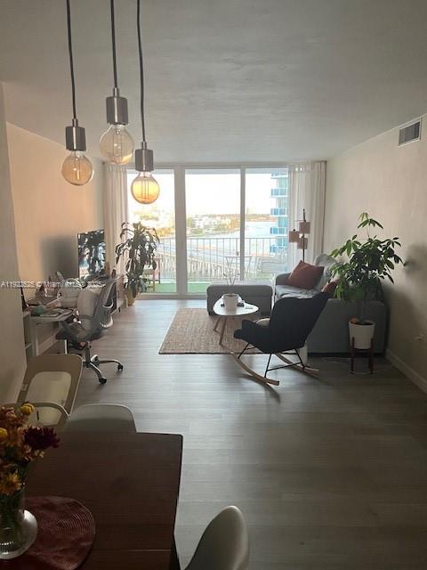 1865 79th Street Causeway, Unit 10C North Bay Village, FL 33141 - Photo 3 of 26 a living room with furniture and a large window