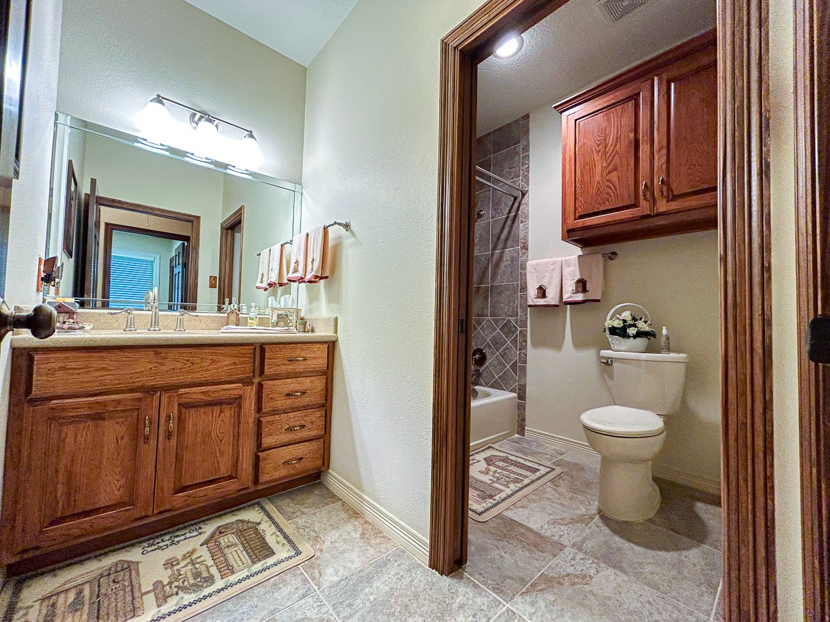 5259 Farm To Market 946 Coldspring, TX 77331 - Photo 13 of 39 a bathroom with a toilet sink and mirror