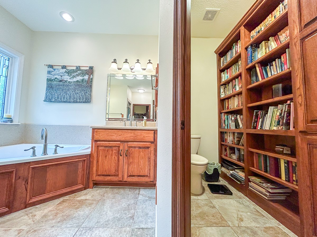 5259 Farm To Market 946 Coldspring, TX 77331 - Photo 18 of 39 a bathroom with a sink a toilet and a mirror