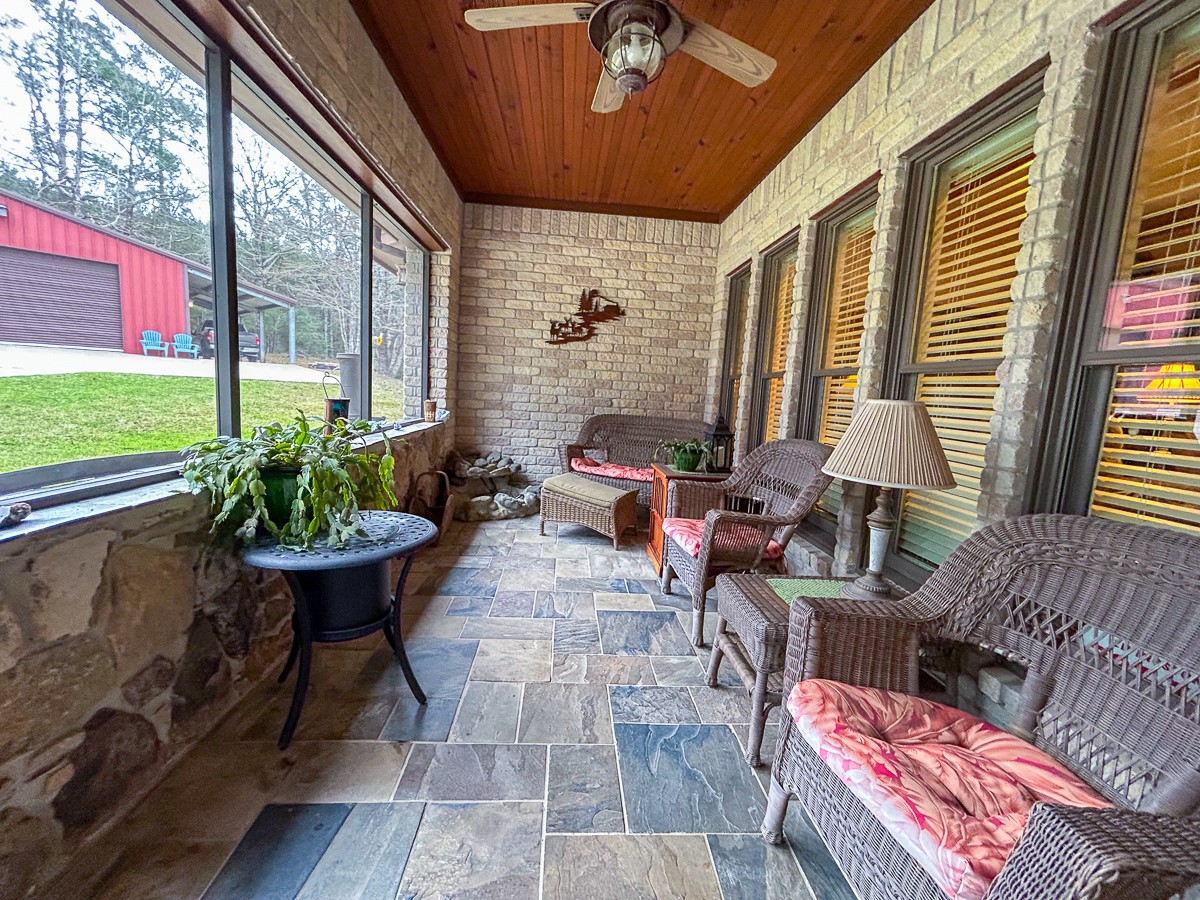 5259 Farm To Market 946 Coldspring, TX 77331 - Photo 22 of 39 a living room with furniture and a large window
