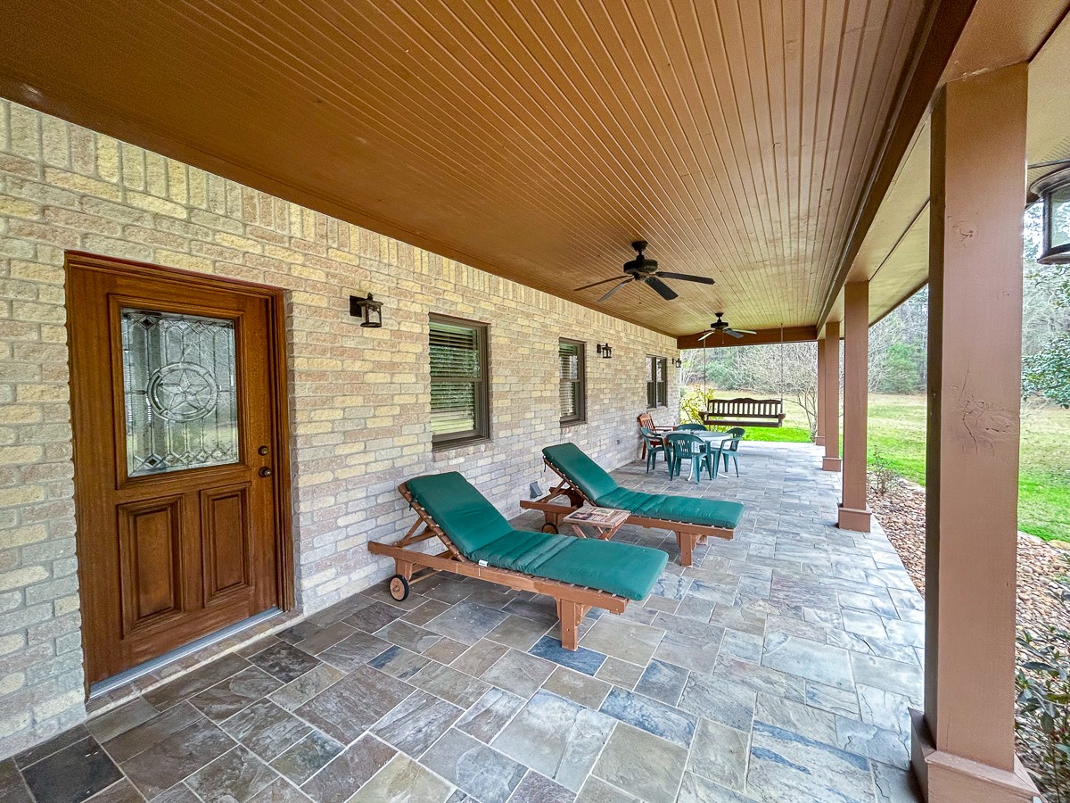 5259 Farm To Market 946 Coldspring, TX 77331 - Photo 23 of 39 a view of a porch with furniture and garden