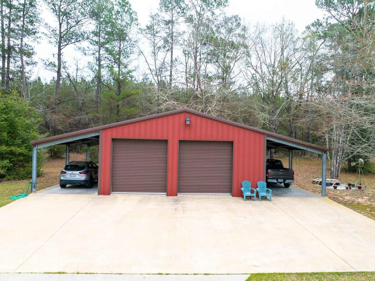 5259 Farm To Market 946 Coldspring, TX 77331 - Photo 25 of 39 a front view of a house with a yard