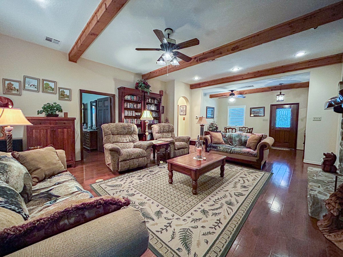 5259 Farm To Market 946 Coldspring, TX 77331 - Photo 4 of 39 a living room with furniture ceiling fan and a rug