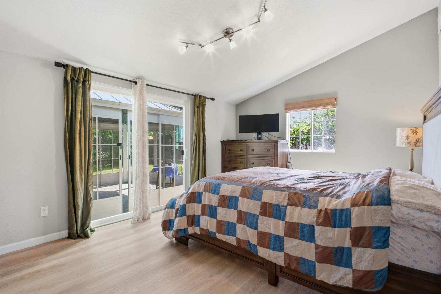 36985 Walnut Street Newark, CA 94560 - Photo 13 of 30 a bedroom with a bed and a dresser next to a window