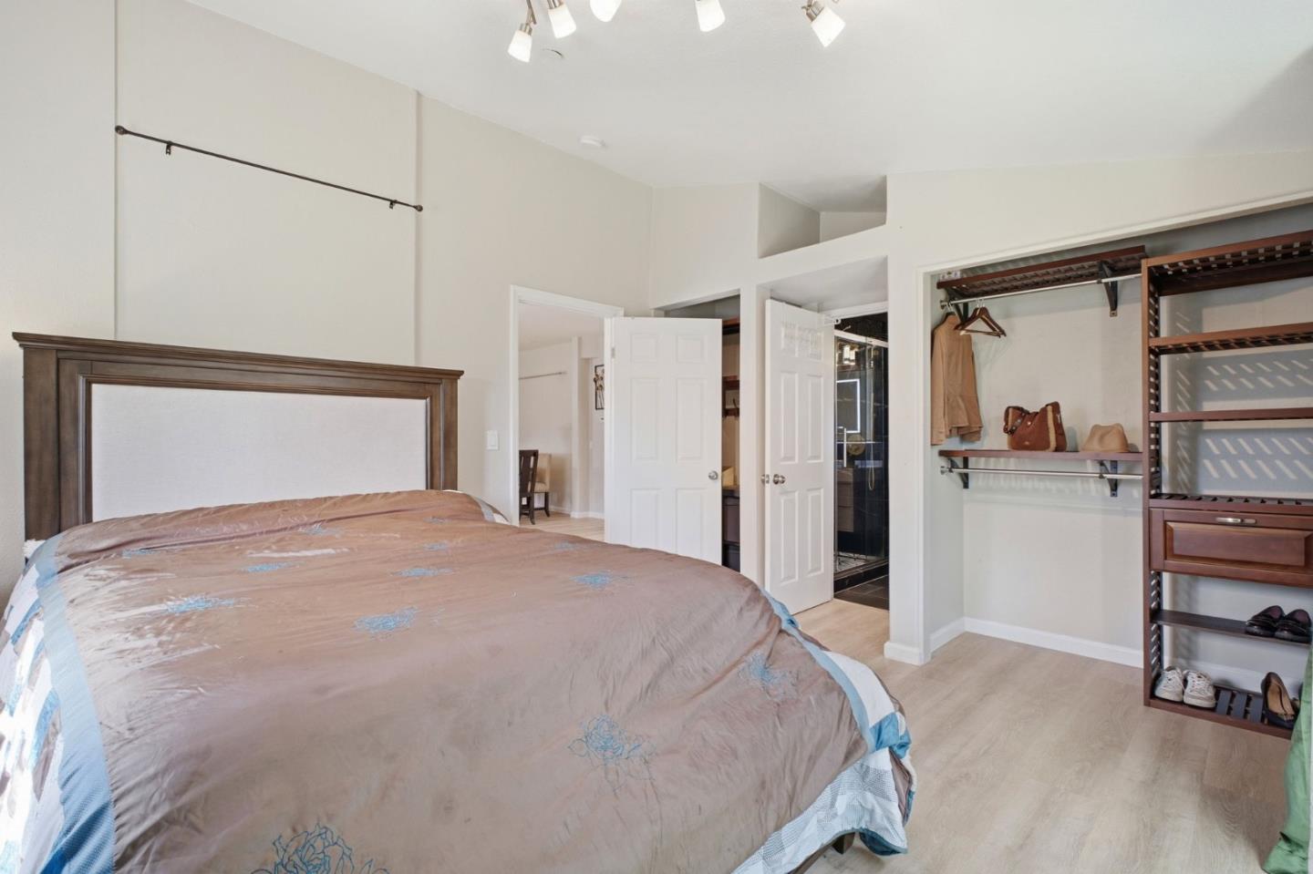 36985 Walnut Street Newark, CA 94560 - Photo 14 of 30 a bedroom with a bed and a chair with the view