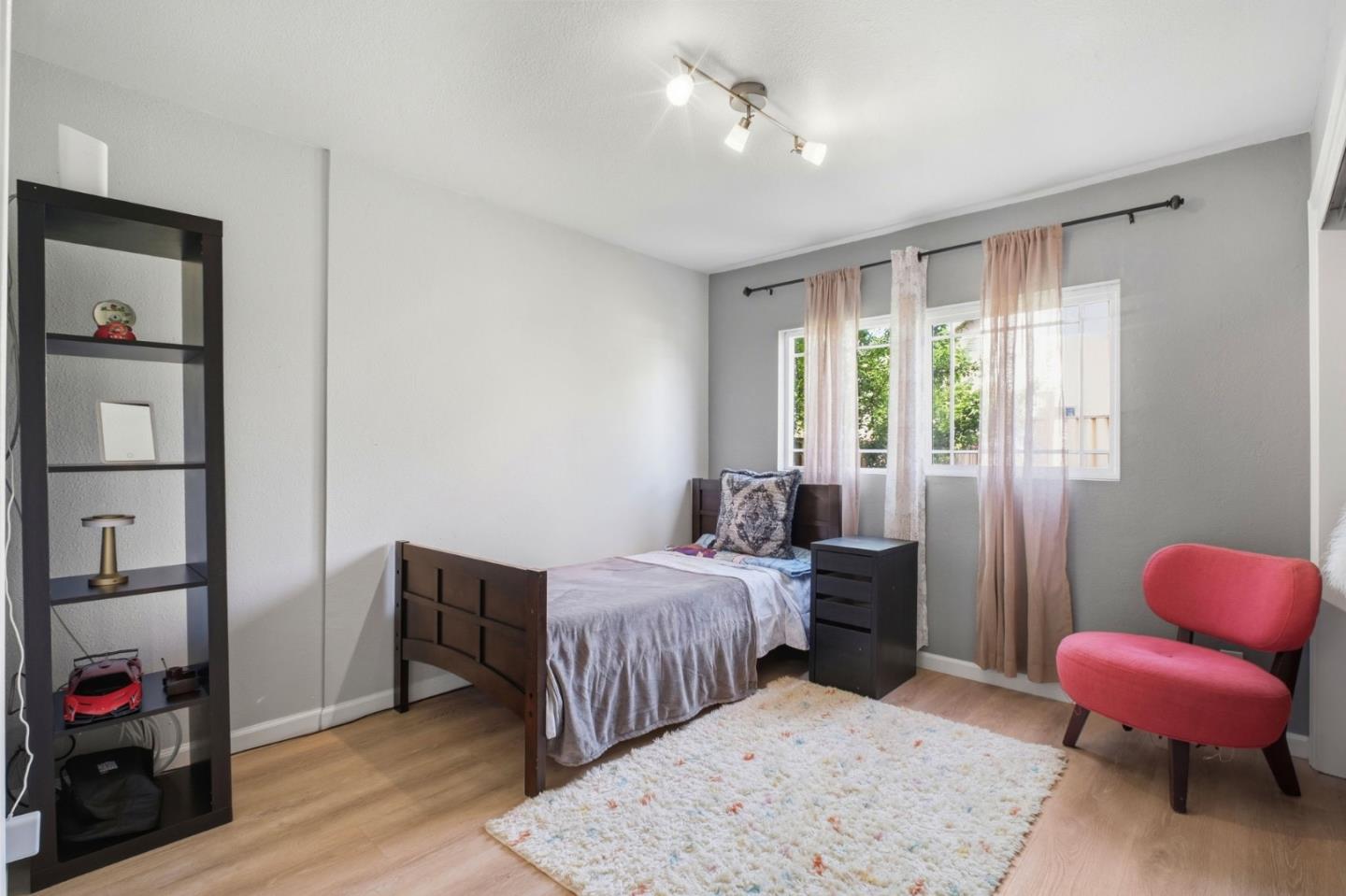 36985 Walnut Street Newark, CA 94560 - Photo 15 of 30 a bedroom with bed and a window