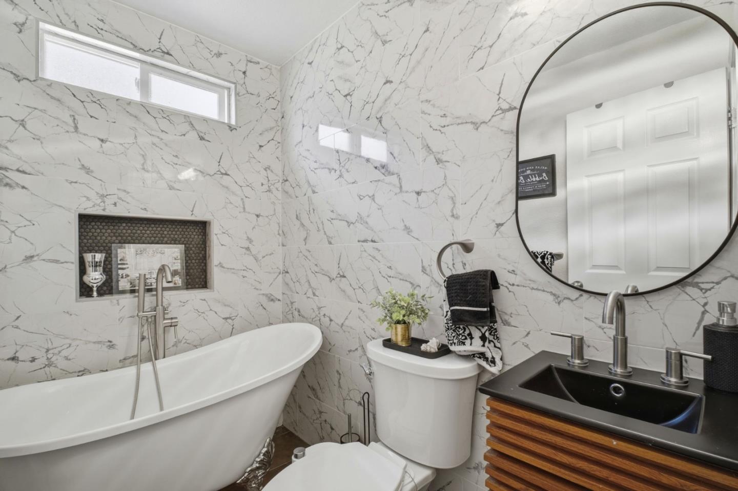 36985 Walnut Street Newark, CA 94560 - Photo 20 of 30 a bathroom with a sink a toilet and a mirror