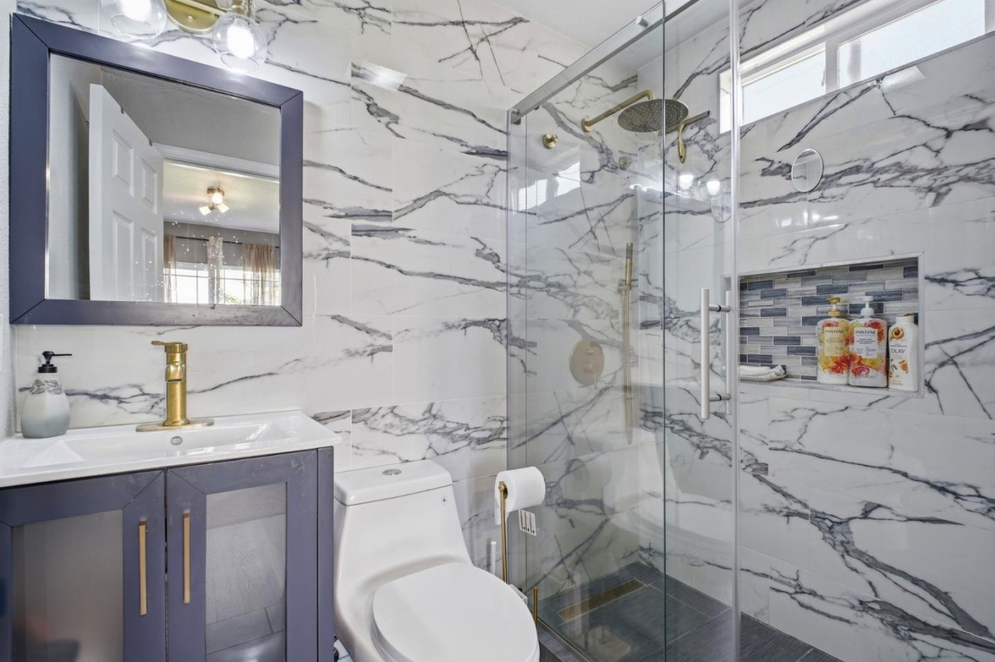36985 Walnut Street Newark, CA 94560 - Photo 21 of 30 a bathroom with a sink toilet and shower