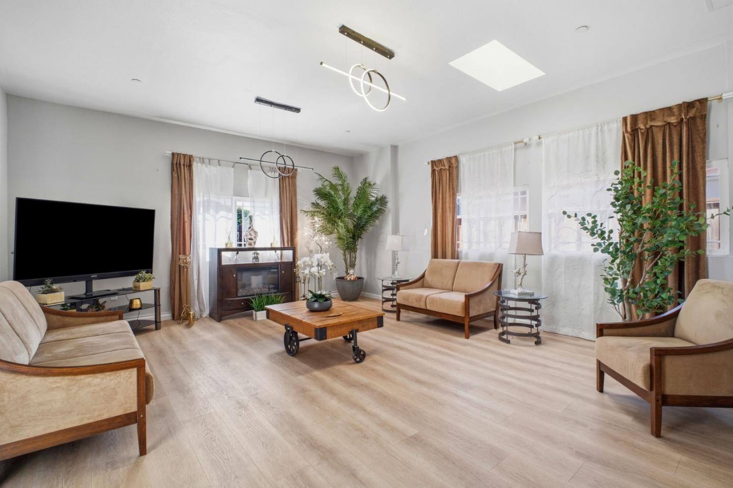 36985 Walnut Street Newark, CA 94560 - Photo 6 of 30 a living room with furniture and a flat screen tv