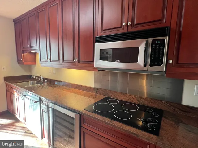 a kitchen with a stove and a microwave