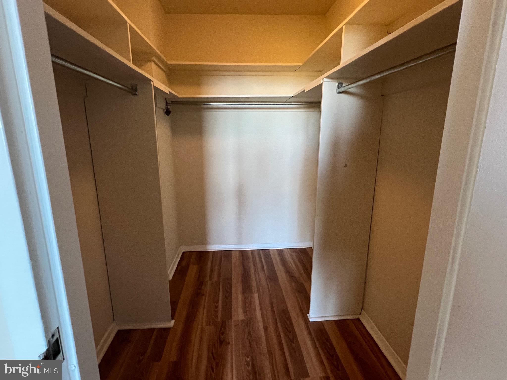 4401 Roland Avenue, Unit 402 Baltimore, MD 21210 - Photo 27 of 43 a view of walk in closet with wooden floor