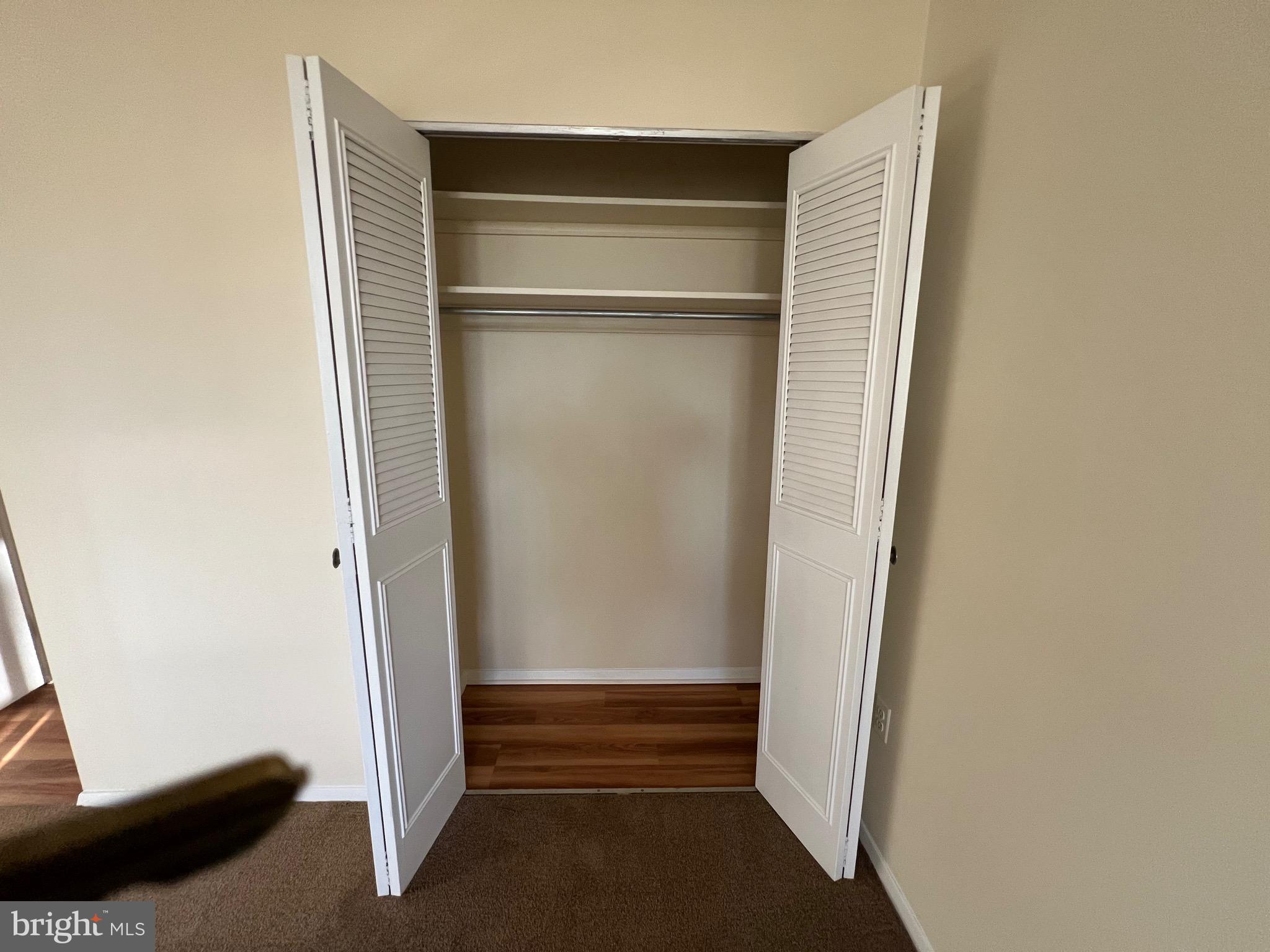 4401 Roland Avenue, Unit 402 Baltimore, MD 21210 - Photo 32 of 43 a view of walk in closet with empty racks