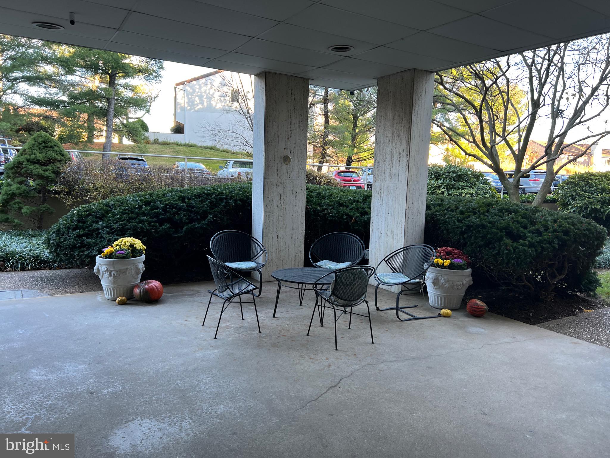 4401 Roland Avenue, Unit 402 Baltimore, MD 21210 - Photo 39 of 43 a view of a patio with chairs and a table
