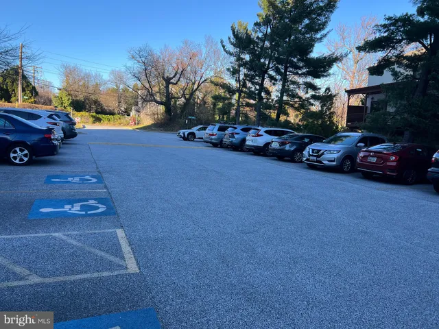 a view of street with parked cars