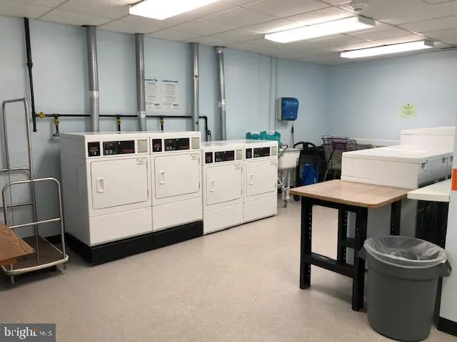 a kitchen with a table chairs and a stove