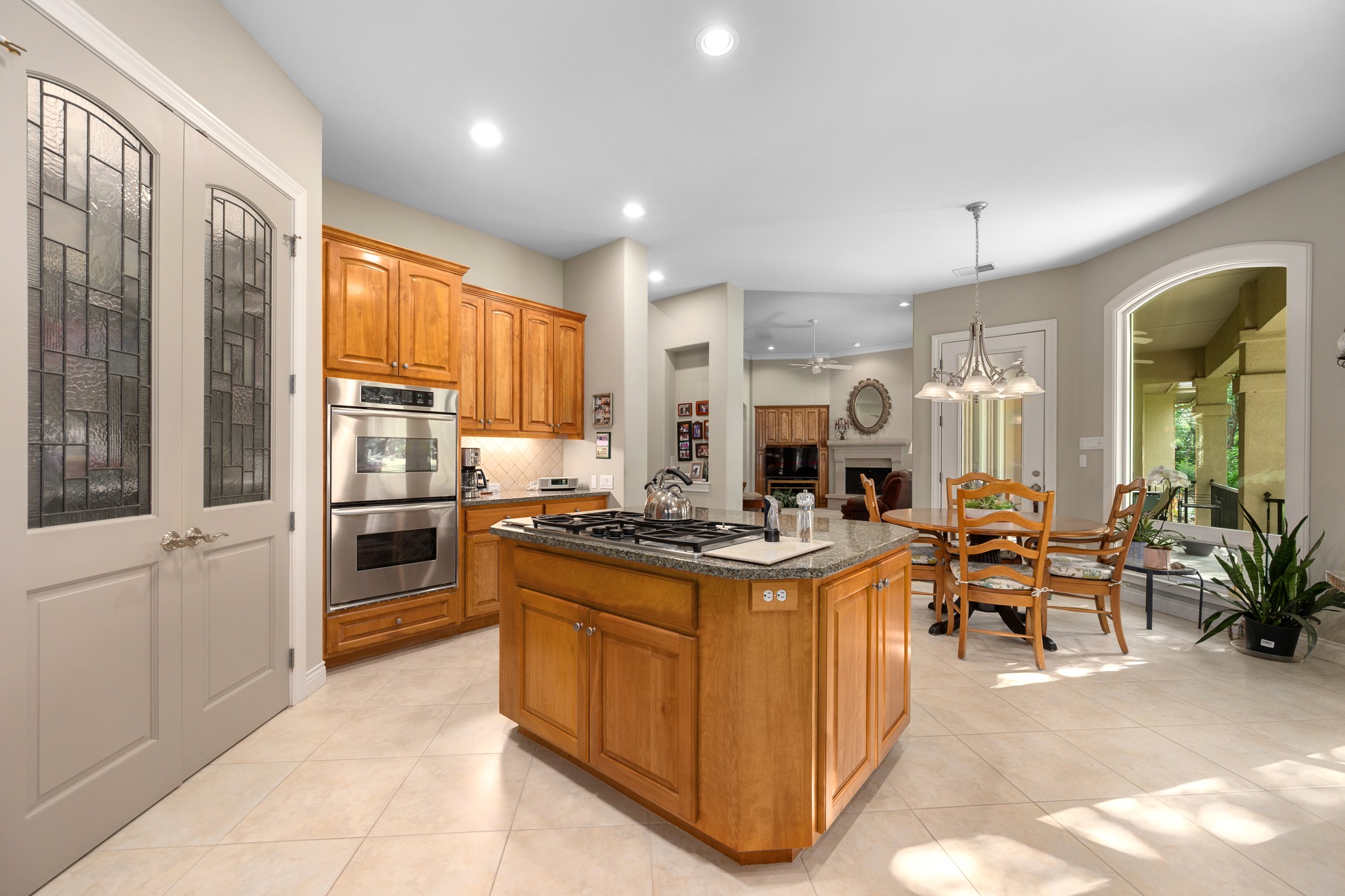 29 Meadows End Georgetown, TX 78628 - Photo 12 of 38 a kitchen with stove a refrigerator and chairs